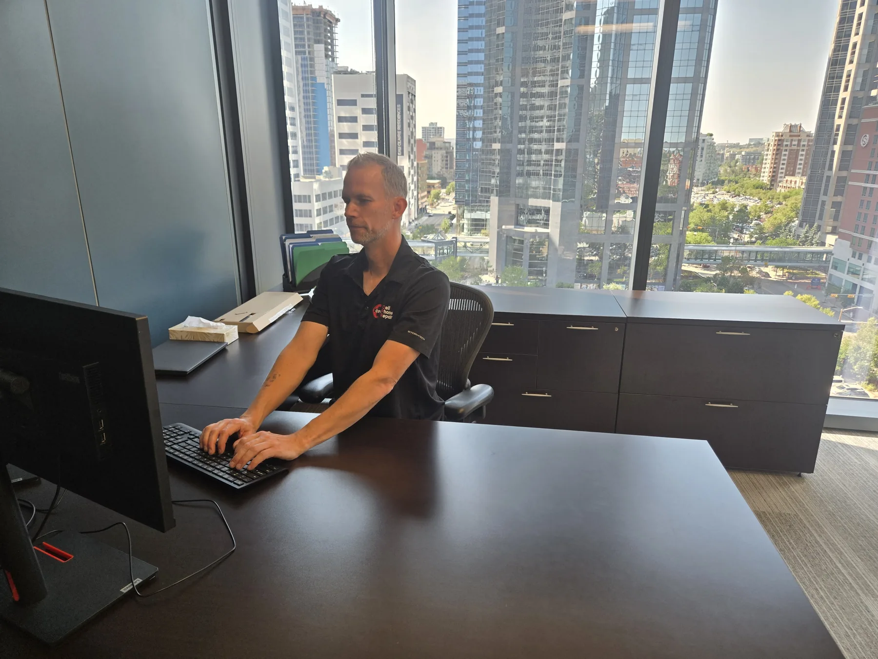 Geoff working at a business workstation